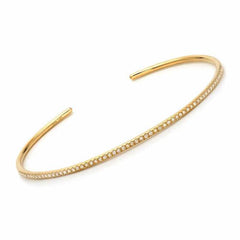 Thin 14k gold cuff with diamonds in yellow gold