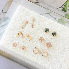 a selection of beautiful rose gold and diamond studs with rainbow moonsotne and london blue topaz